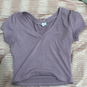 A purple crop top shirt V neck